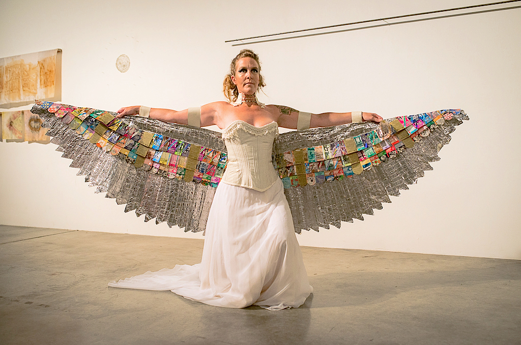 White Owl Goddess - Corset- vinyl boat upholstery, canvas bag, table trim lace, 26" waist finished. Skirt- bottom half of vintage wedding dress, Wings- drapery, lead foil used in dental film, metro bus passes, tent sticks, rattan drapery, leather belt, chain, table trim lace, crystal from chandler, jade beads, pearl beads, 92x25”