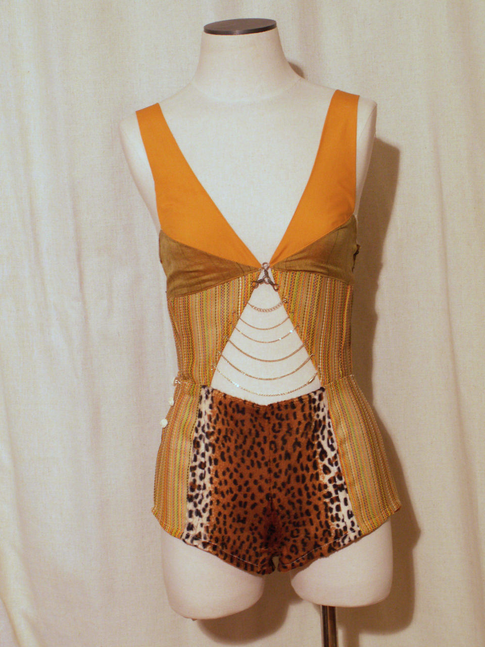 Tiger Onesie- woven plastic, fake fur, cotton fabric, vintage buttons, fireplace chain, various necklace chains, wire, Size medium